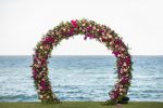 Knowing how to decorate a wedding arch with silk flowers can save you money while still giving you your dream wedding decor. Check out tips on how to do it!