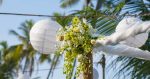 closeup of beautiful wedding decorated on beach wedding arch with lights setup