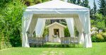 Decorative place for ceremonies or entertainments. Outdoor reception under tents and tree