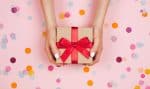 maid of honor gift in a brown box with red bow on pink background