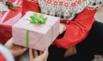 pink gift box with green ribbon