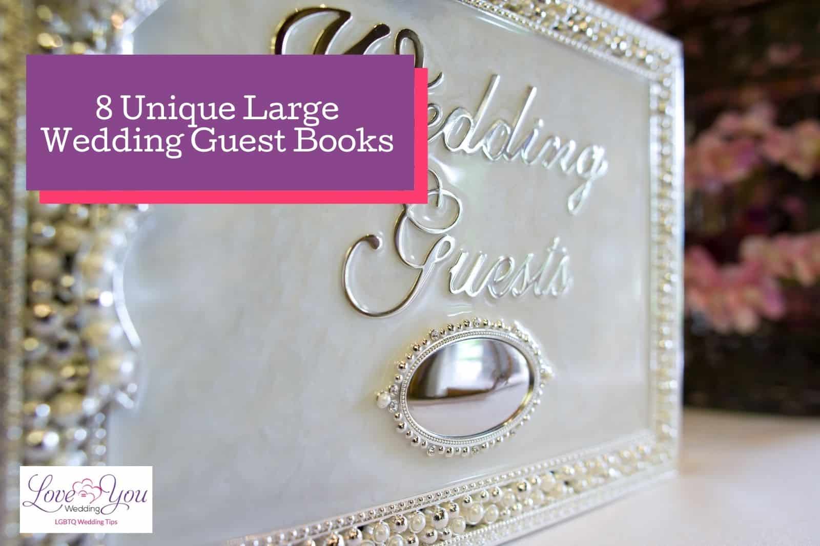 a silver large wedding guest book with a cursive "Wedding guests" lettering