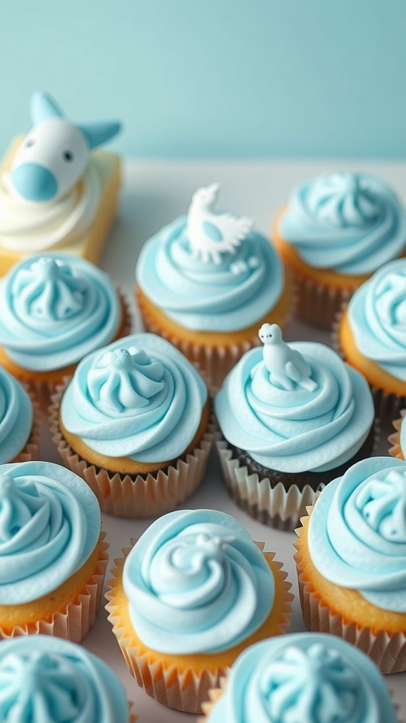 Cupcakes with baby blue frosting and cute animal dessert toppers