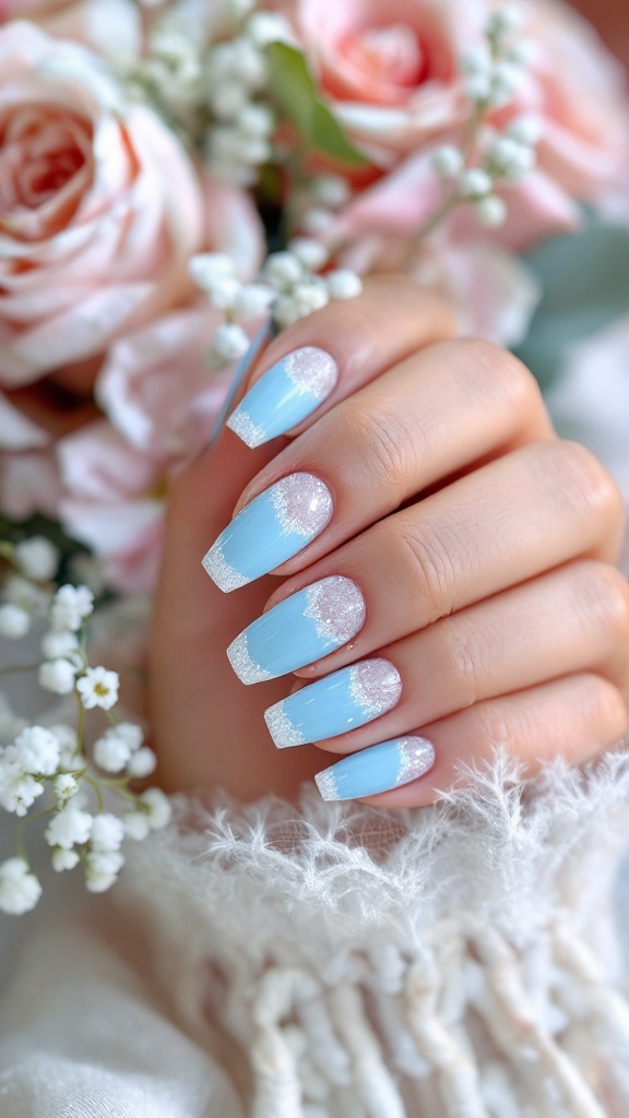 A close-up of wedding nails featuring sky blue polish with glitter tips, surrounded by roses and floral accents.