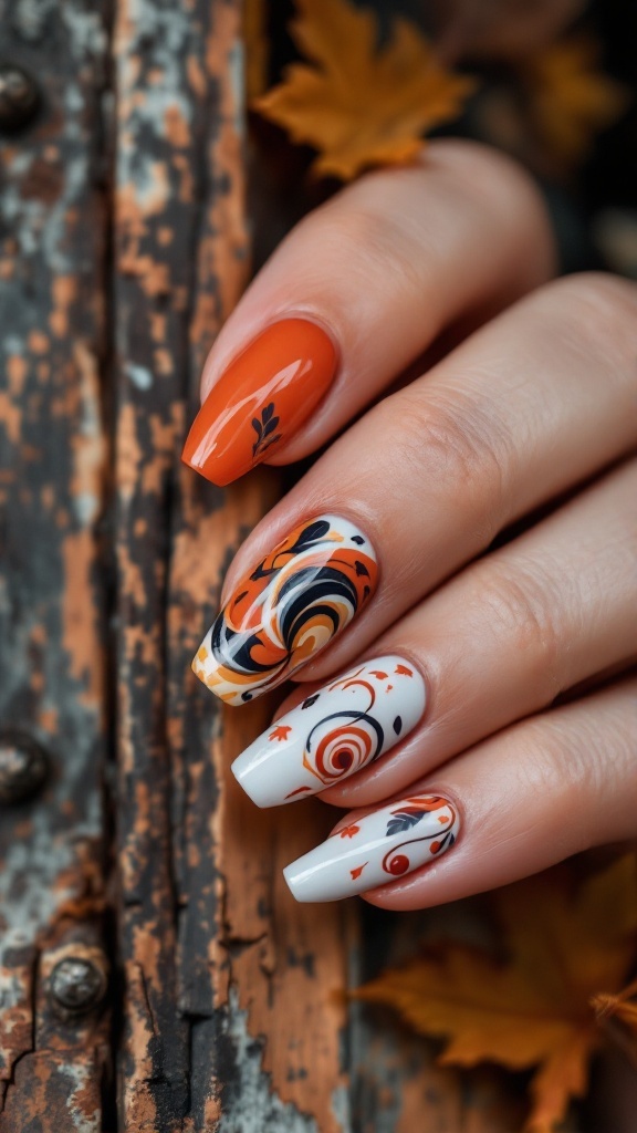 A close-up of hands showing fall-themed swirl nail designs featuring orange, white, and black colors.