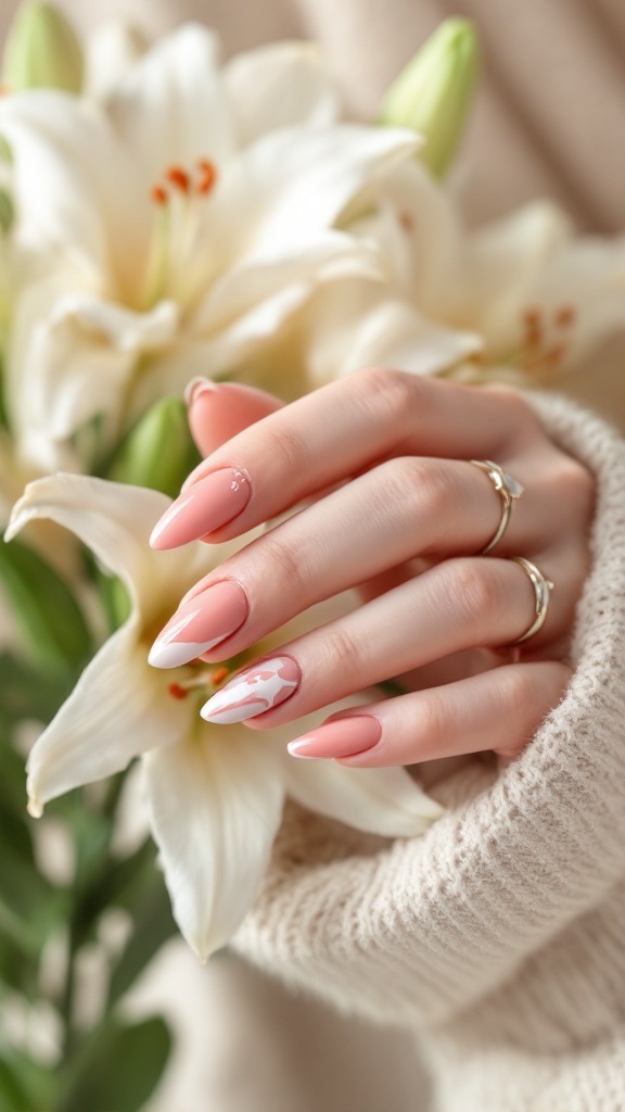 Close-up of a hand with matte finish nails featuring glossy tips, holding flowers
