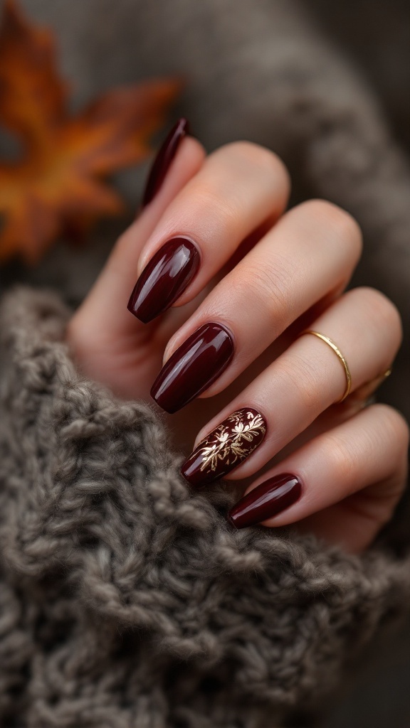 Burgundy nails with gold detailing, showcasing a boho wedding style