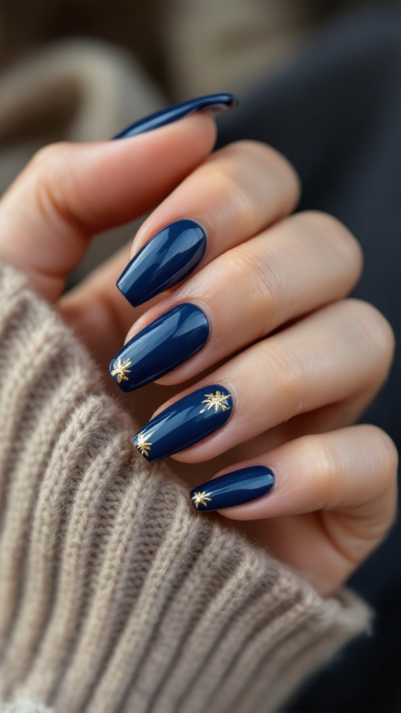 A close-up of navy blue wedding nails with gold accents, showcasing a glossy finish and elegant design.
