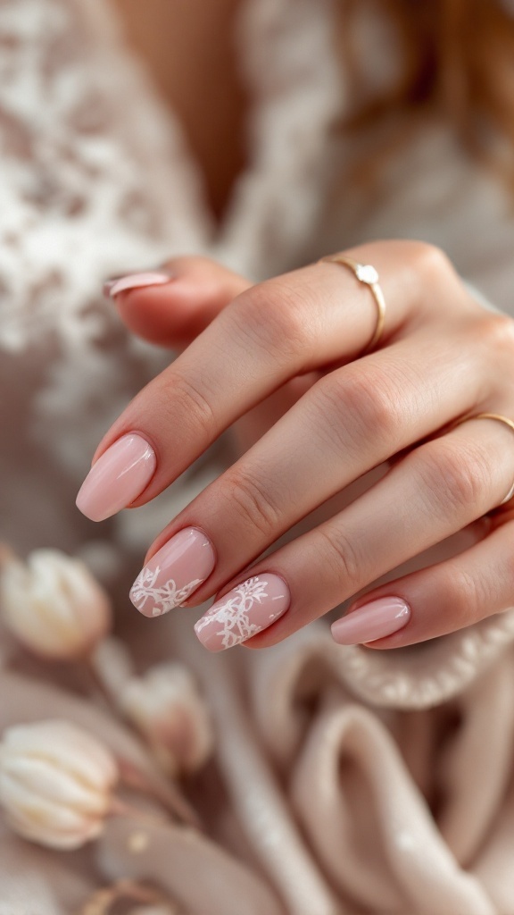 Elegant wedding nails with a lace design and soft pink base.