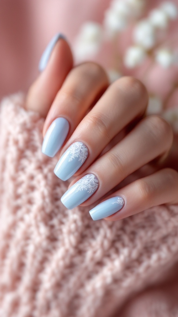 Light blue wedding nails with lace patterns on a knitted background