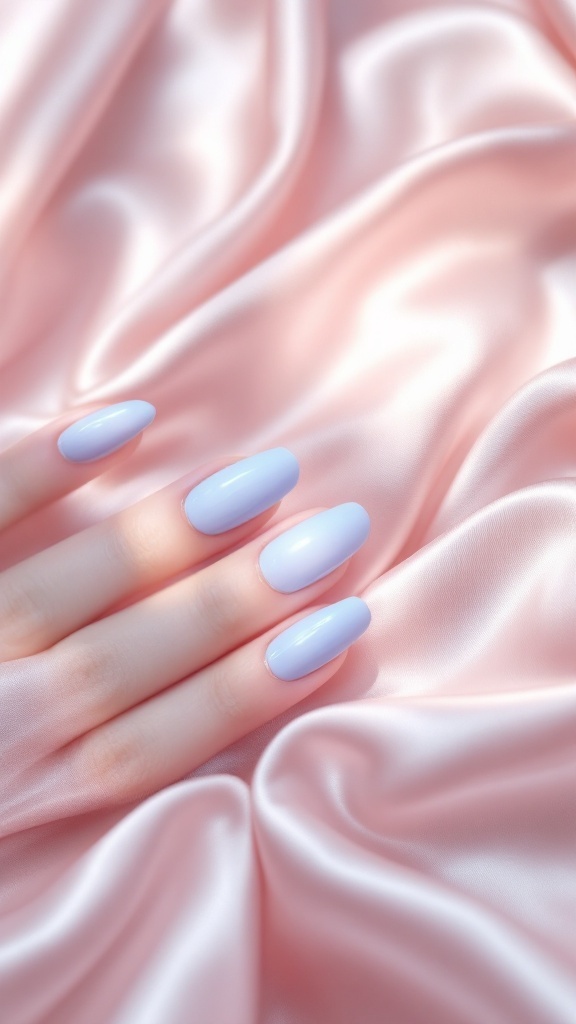 A hand with light blue nails and minimalist lines resting on pink fabric.