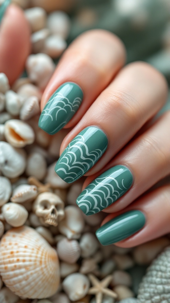 Marine green nails with wave patterns, surrounded by seashells and soft fabric.