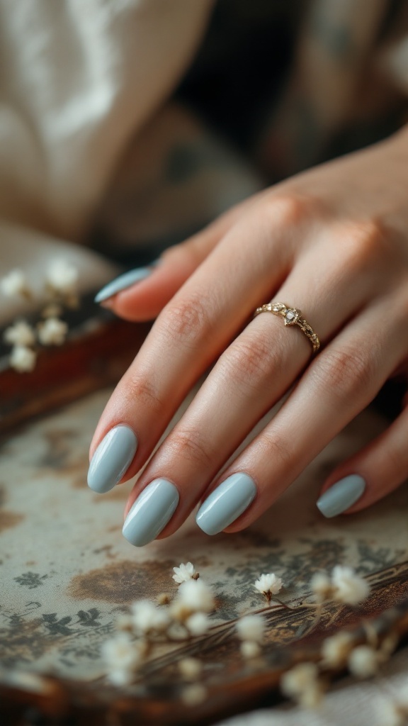 Vintage-inspired light blue wedding nails with a delicate ring