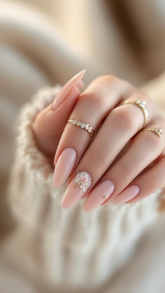 Close-up of elegantly manicured nails with 3D floral designs and rings.