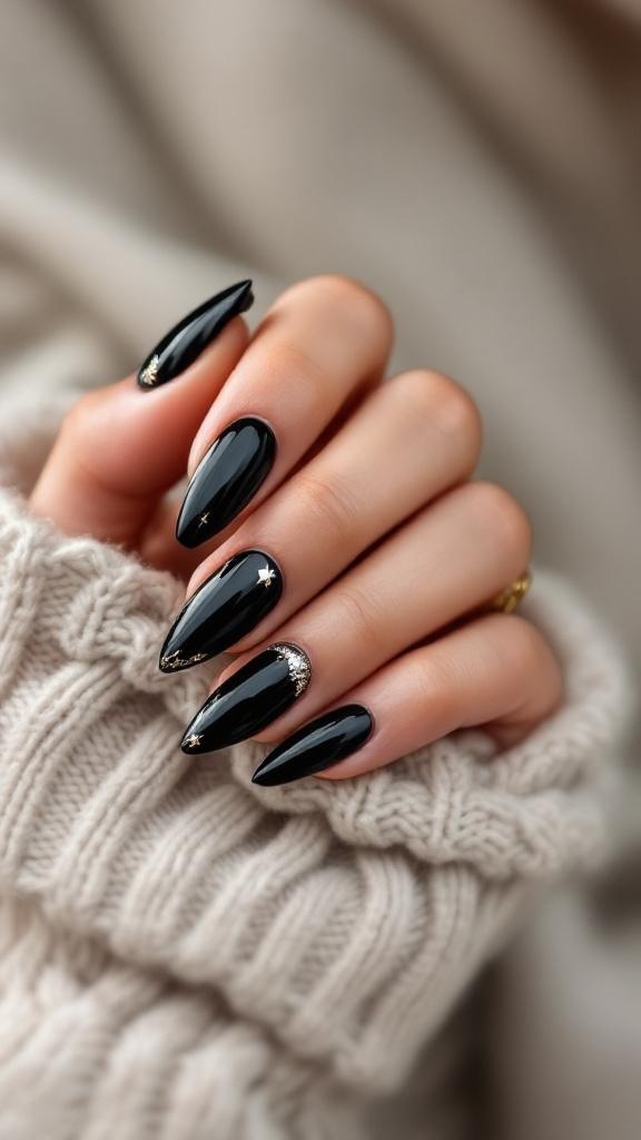 A hand with black stiletto nails featuring metallic accents, resting on a cozy knitted sweater.