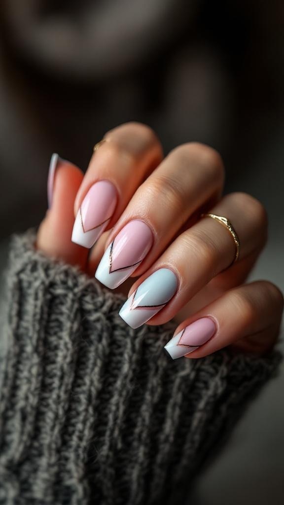 Short acrylic nails with pink and blue French tips featuring a zigzag design.