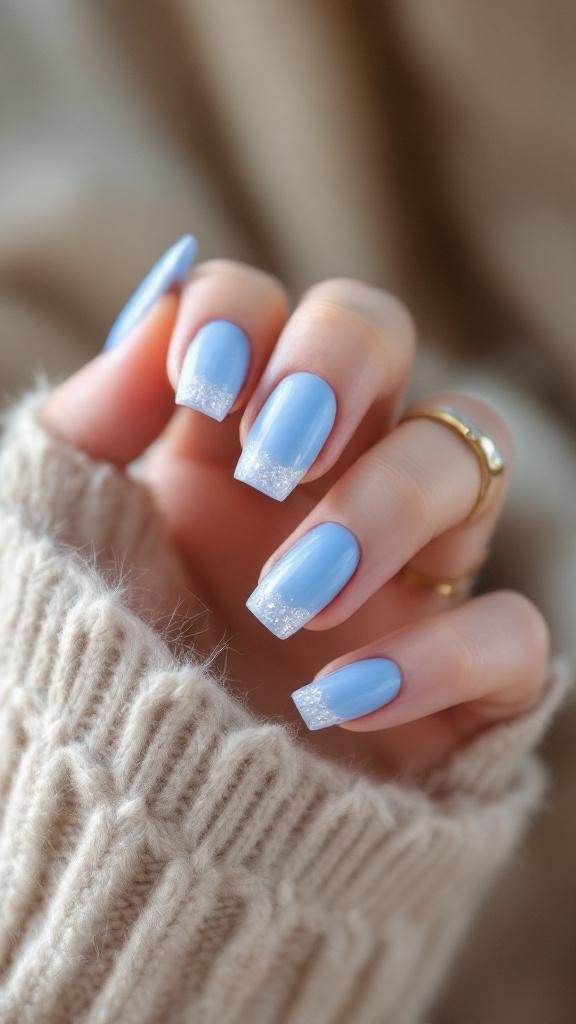 Frosted blue acrylic nails with crystal tips, showcasing a stylish and elegant design.