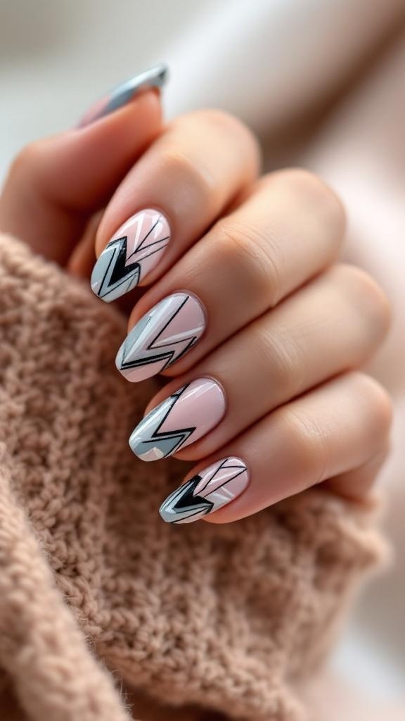 Close-up of hands with chrome nails featuring geometric patterns in pink and black.