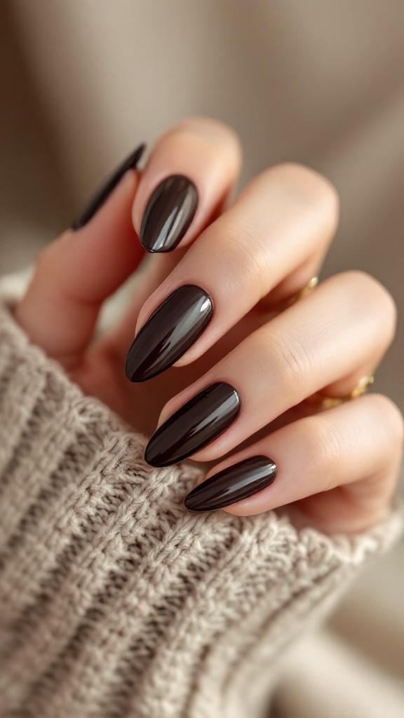 A hand with dark brown glossy nails, showcasing a polished finish.