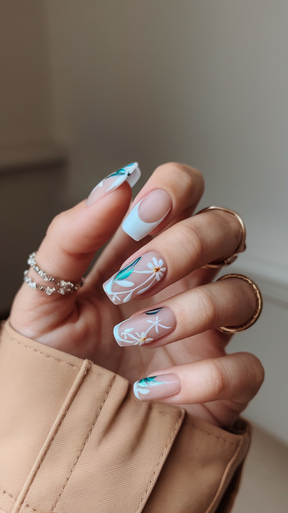 Nature-inspired mystical nails with floral designs and soft colors.