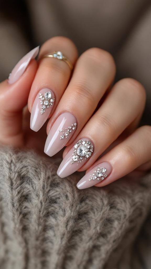 Nails with rhinestone accents on a knitted sweater background