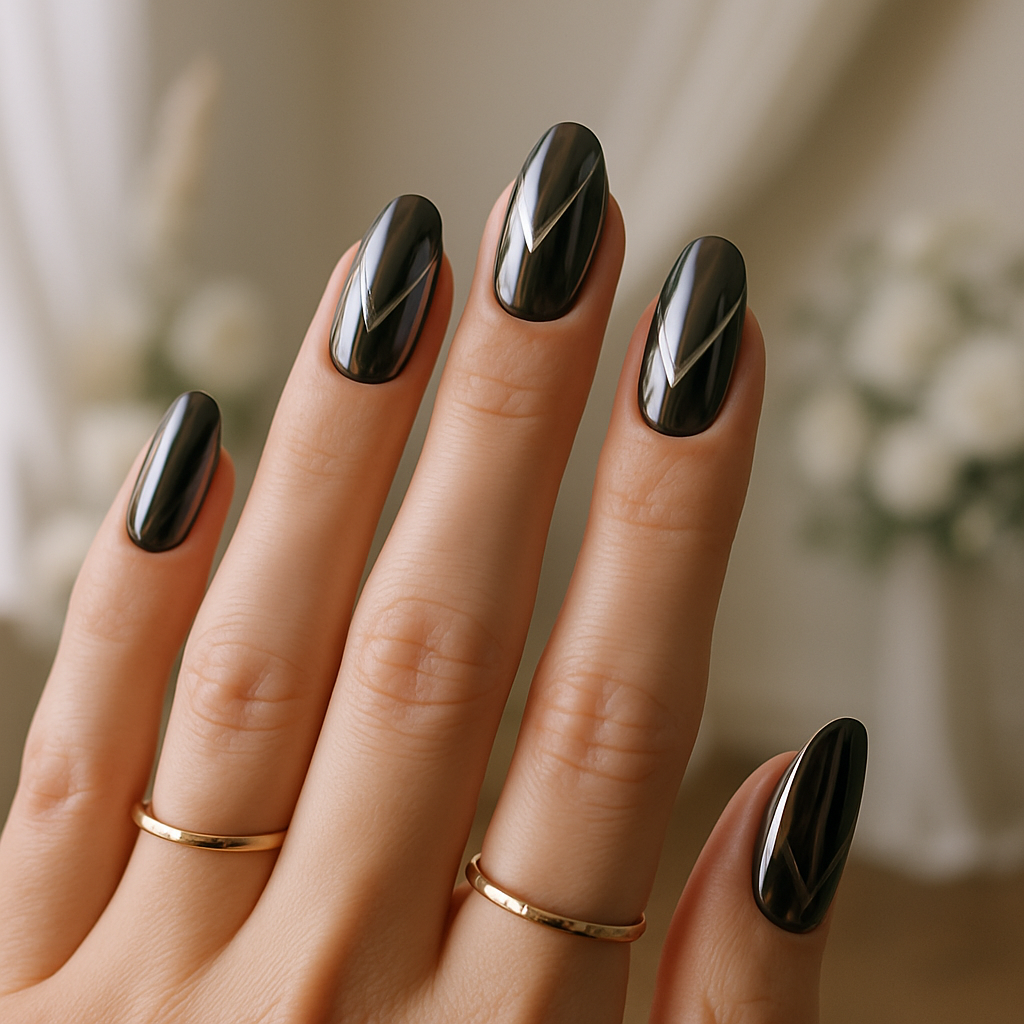Close-up of hands with bold dark chrome nails and gold rings, showcasing a modern bridal look.